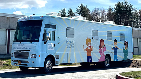 PRASAD’s mobile dental clinic providing free children’s dental services in upstate New York communities.